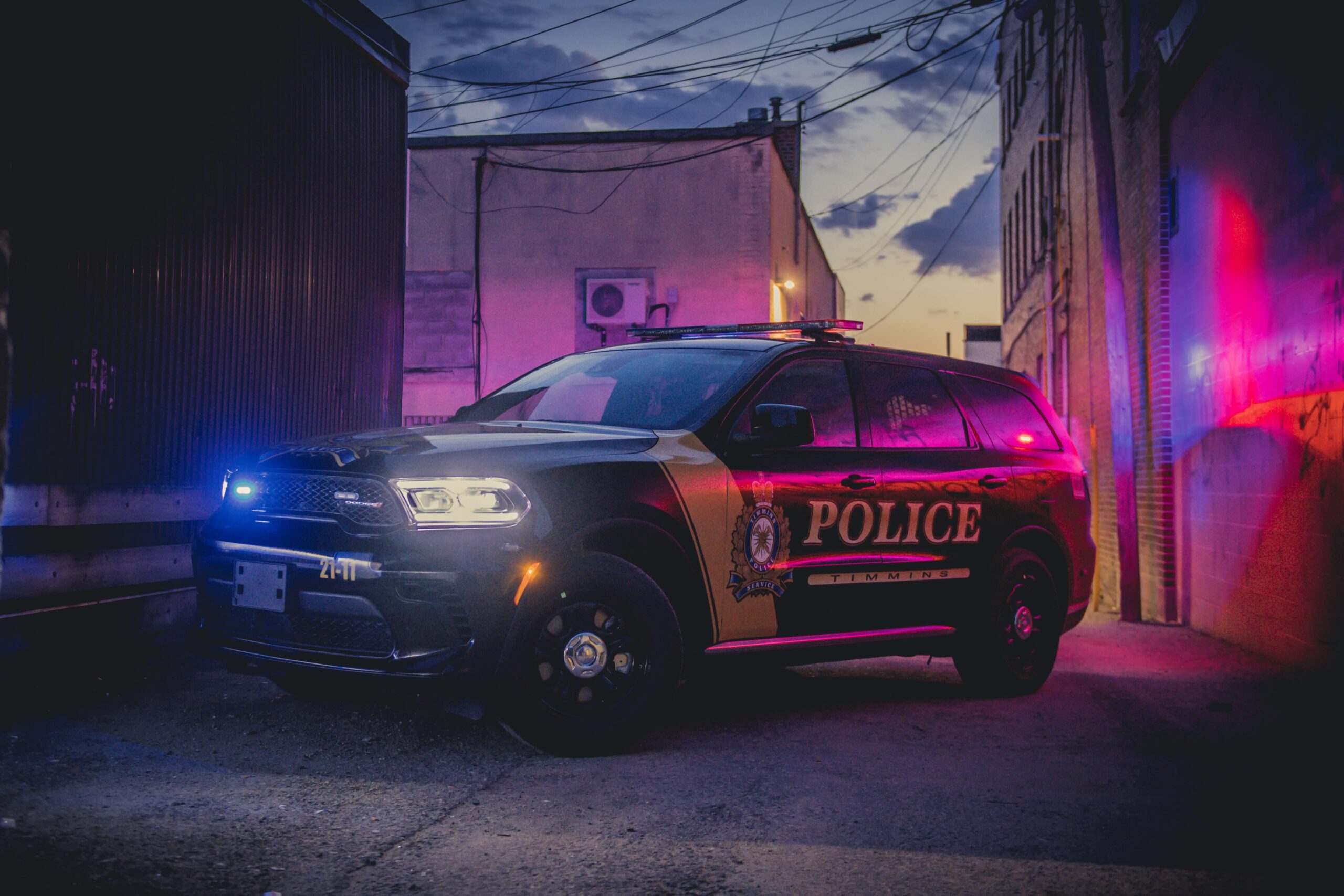 Timmins Police A Timmins police car parked in a dark alley in Timmins, Ontario.